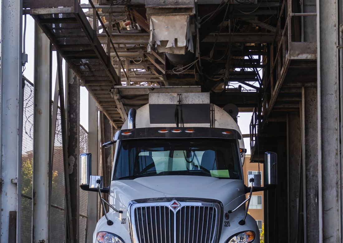 Magnus Trans truck parked at a distribution yard